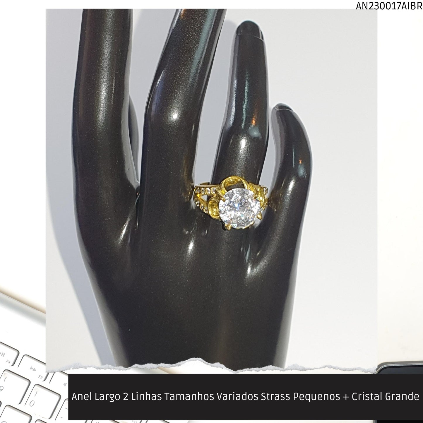 Anel Largo 2 Linhas Tamanhos Variados Strass Pequenos + Cristal Grande  - Código.: AN230017AIBR  - Peso.: 5.9 gr
