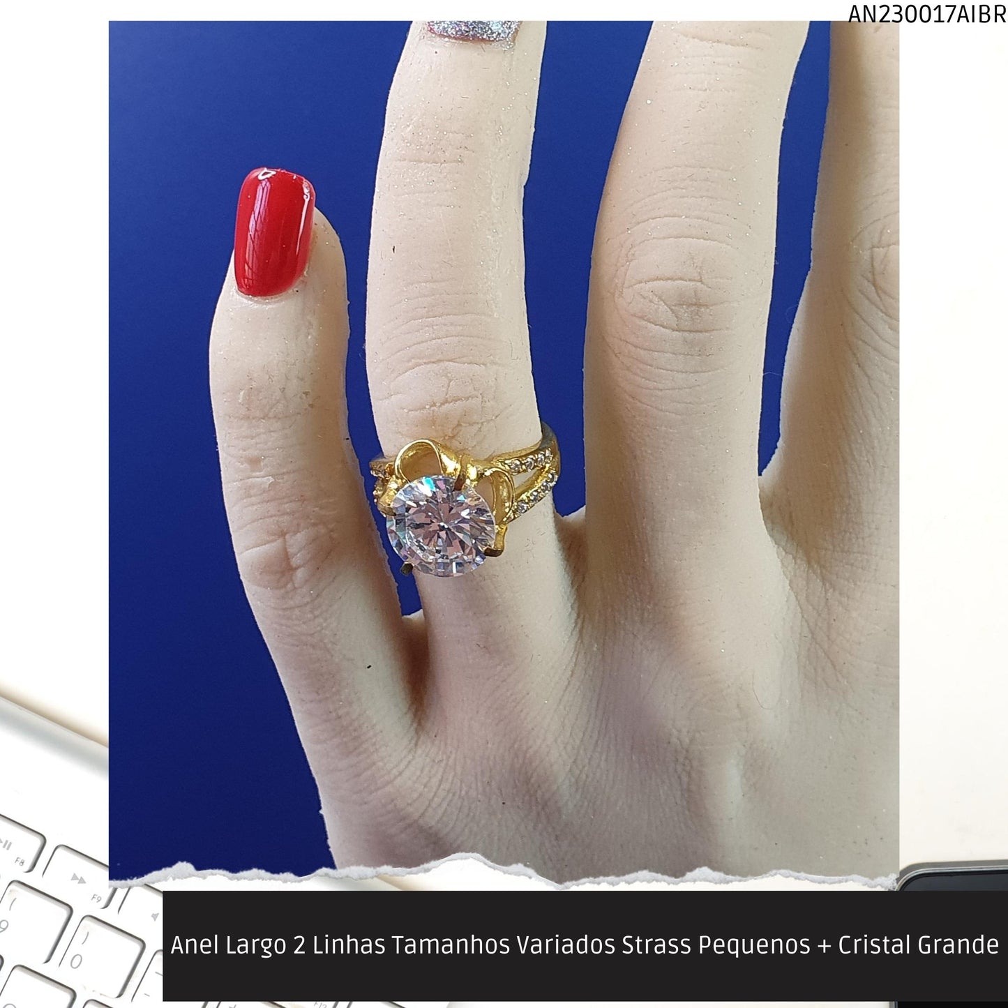 Anel Largo 2 Linhas Tamanhos Variados Strass Pequenos + Cristal Grande  - Código.: AN230017AIBR  - Peso.: 5.9 gr